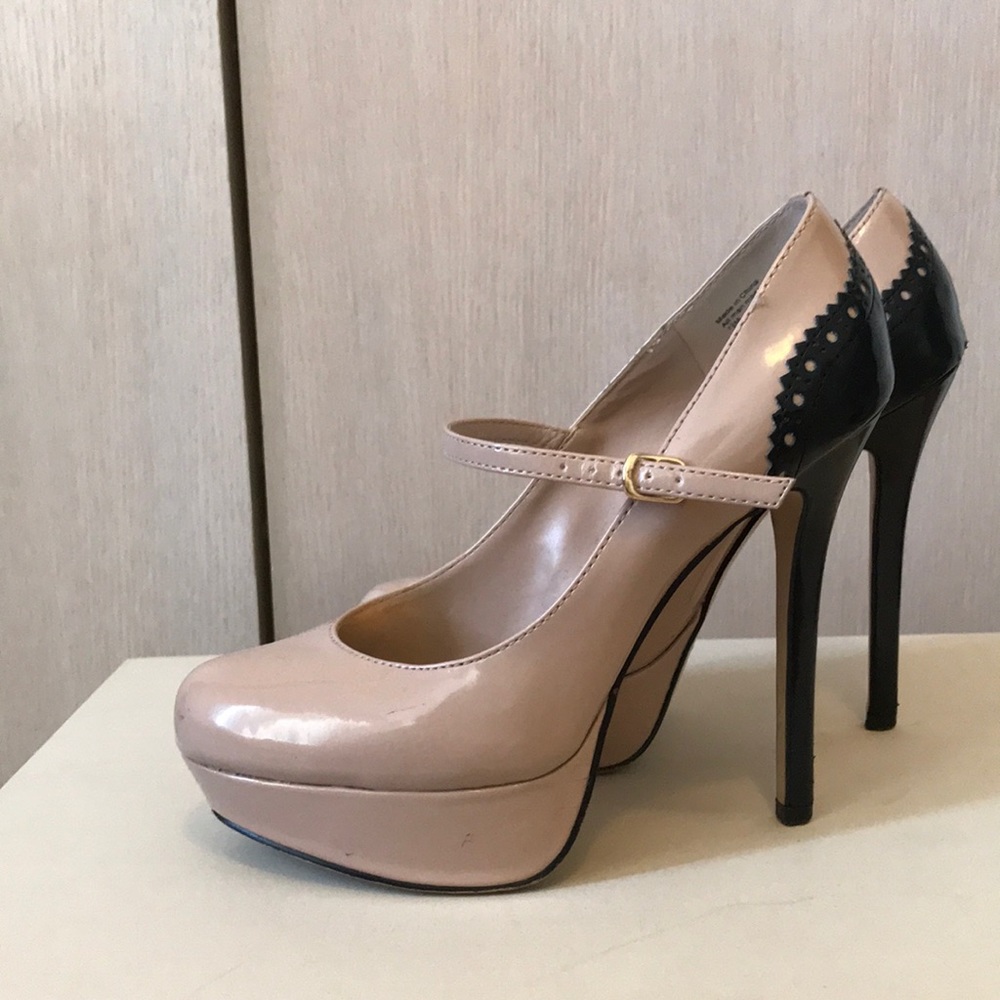 Nude and black platform heels